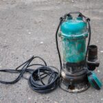 Old,Submersible,Sewage,Pump,On,The,Ground.,An,Old,Submersible